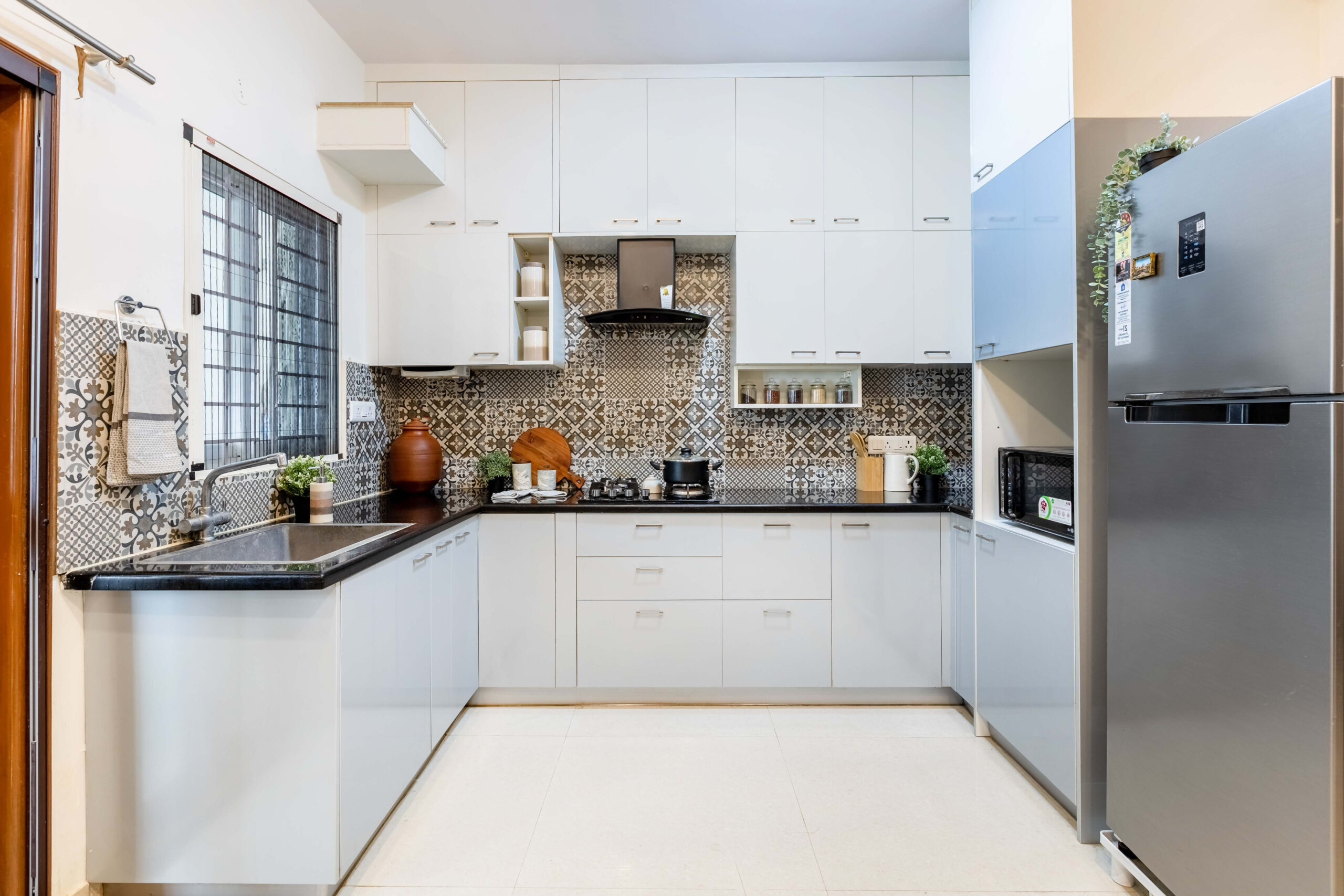 Spacious Modular Kitchen Design With Light Blue And White Storage Units | Livspace for Transform Your Kitchen with Smart Lighting Choices